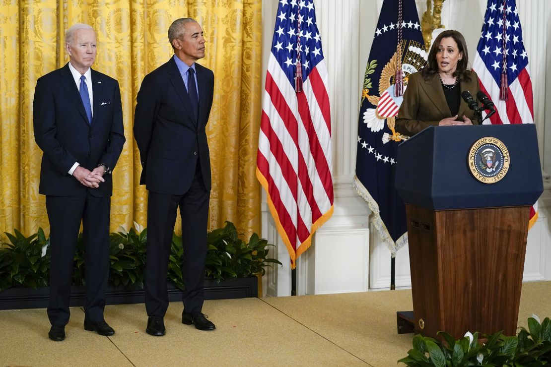 President Joe Biden and former President Barack Obama listen as Vice President Kamala Harris speaks about the Affordable Care Act, in the East Room of the White House in Washington, Tuesday, April 5, 2022. (AP Photo/Carolyn Kaster)